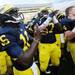 Michigan senior quarterback Denard Robinson celebrates with his team after Michigan beat Air Force 31-25 at Michigan Stadium on Saturday. Melanie Maxwell I AnnArbor.com